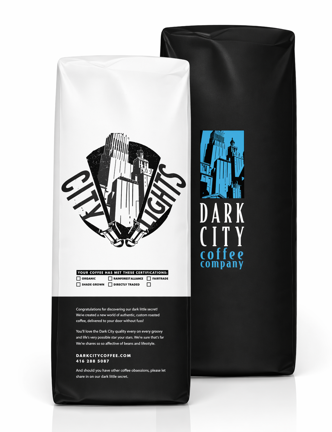 Two coffee bags from Dark City Coffee Company, one white and one black, on a white background.